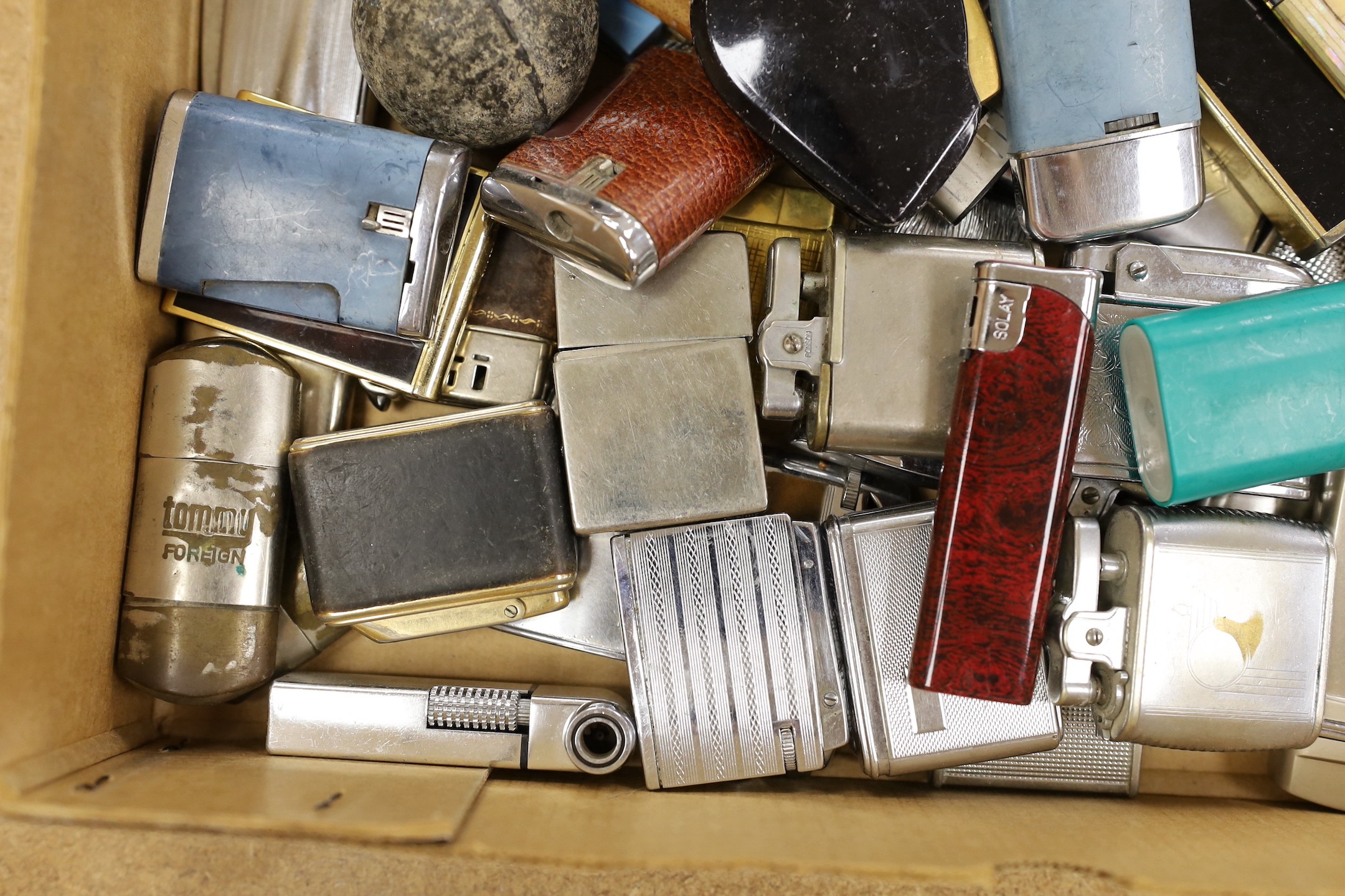 A large collection of lighters and novelty lighters